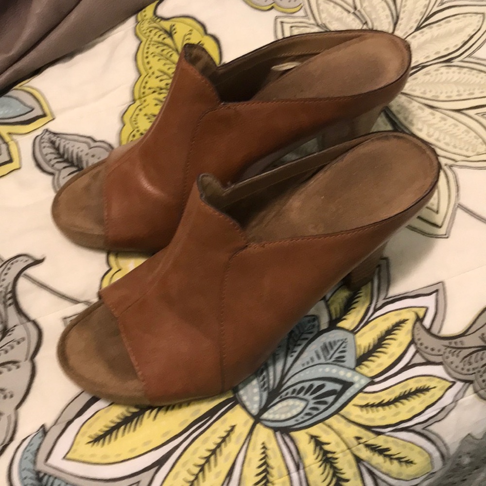 Tan leather slip ins; 3 inch heels.